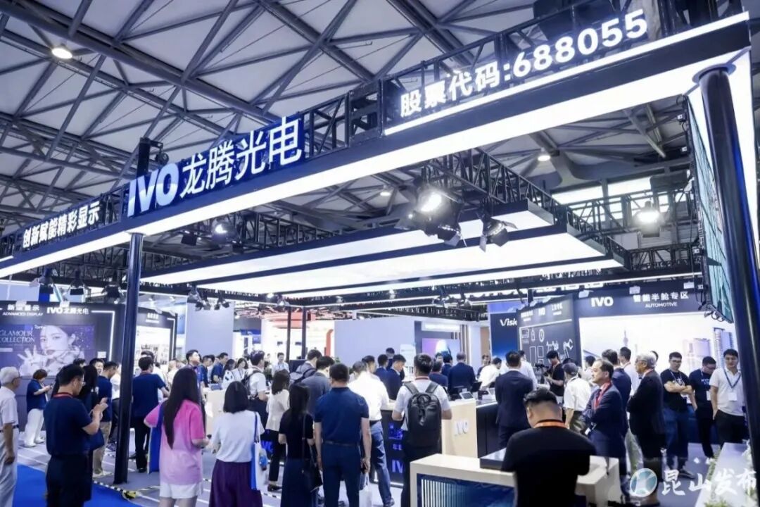 Wide view of IVO's booth at DIC EXPO 2026, with the IVO logo, stock code 688055 displayed above the entrance and visitors exploring automotive and other display zones.